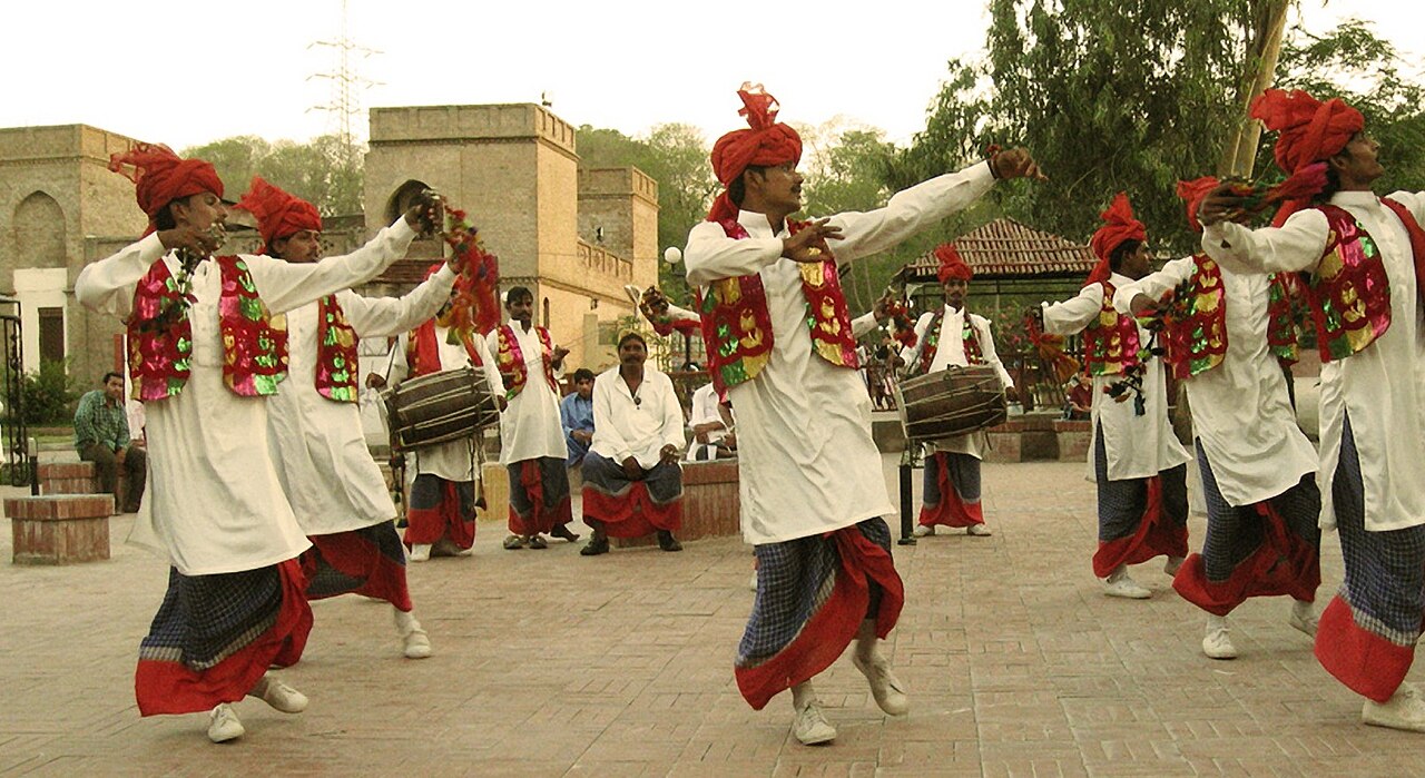 Punjabi dancers performing Bhangra in traditional dress